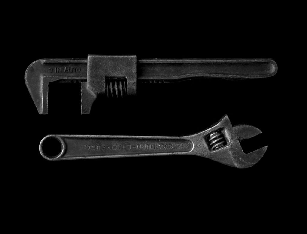 Adjustable wrench and pipe wrench tools Adjustable wrench and pipe wrench, two of the tools needed to connect a dishwasher to the water supply