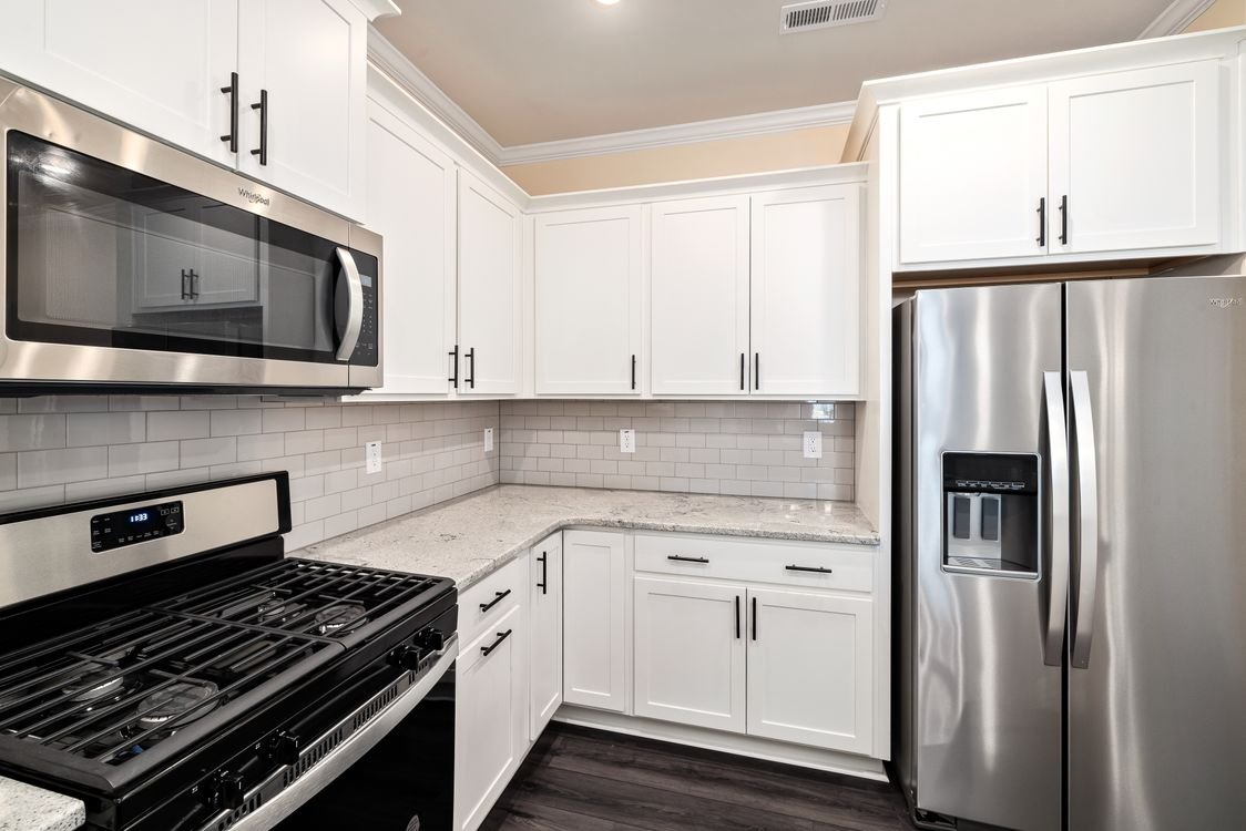 modern kitchen with stainless steel appliances and gas range