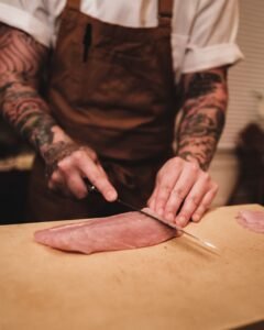 What is a slicing knife used for: chef slicing raw meat