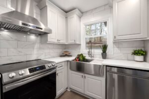 stainless steel range hood over a gas stove in a modern kitchen