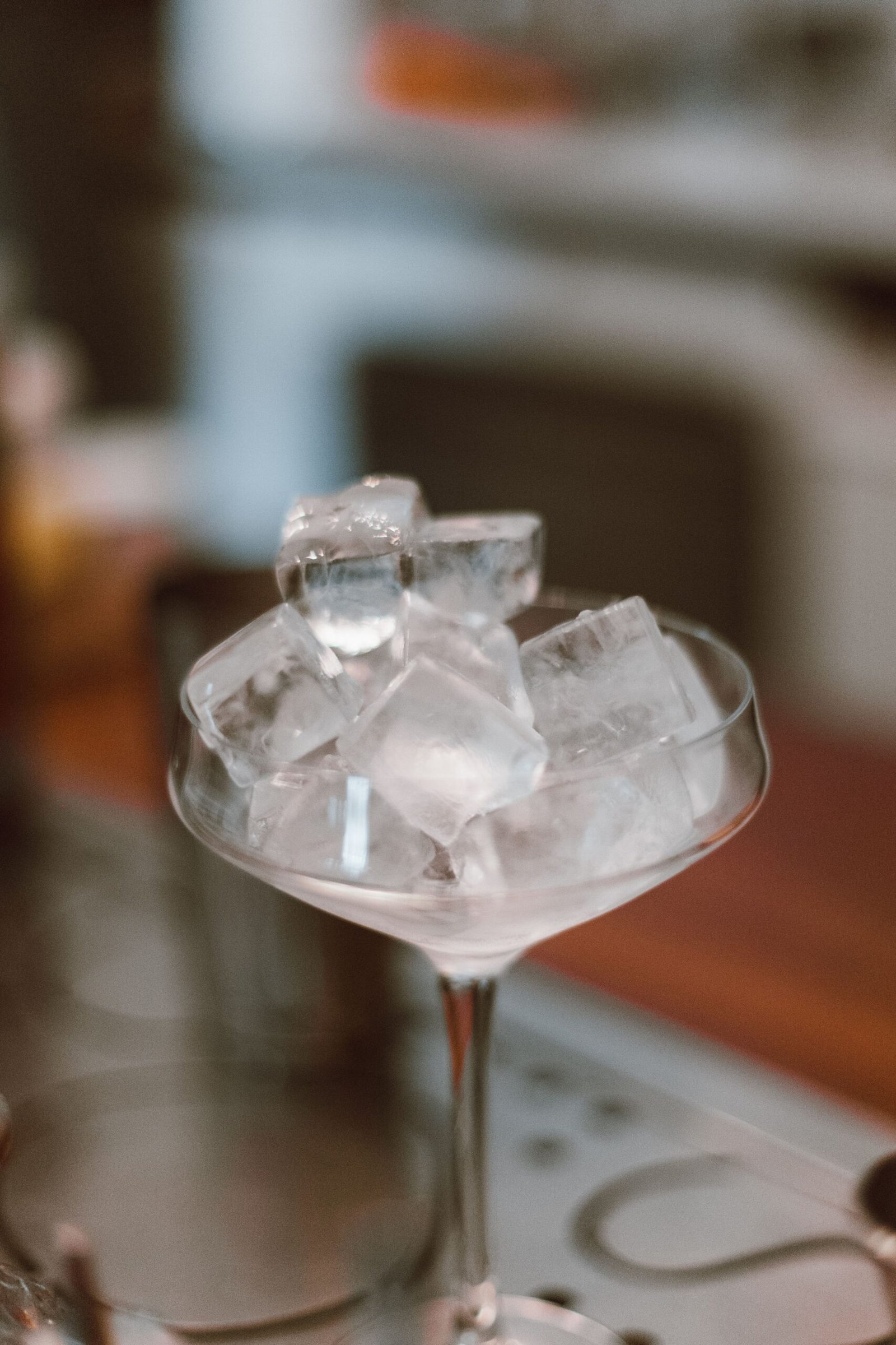 close-up of a cocktail glass filled with crushed ice