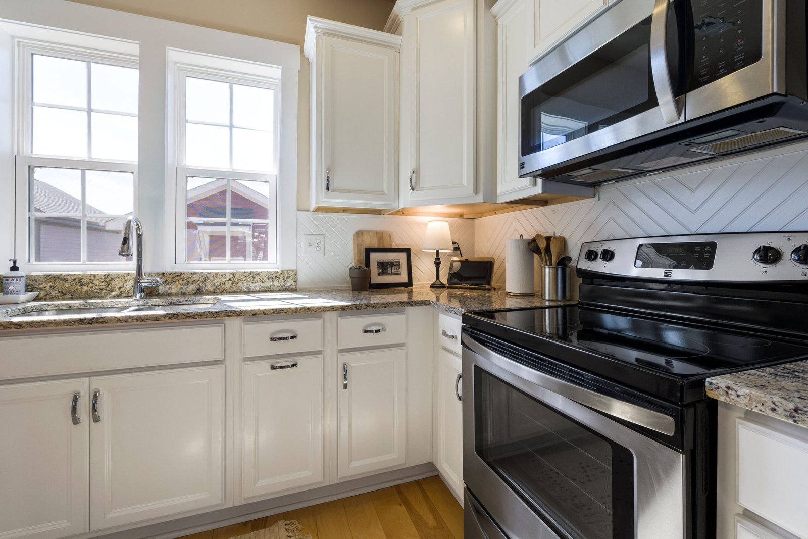 Modern kitchen with a stainless steel range combining a stovetop and oven