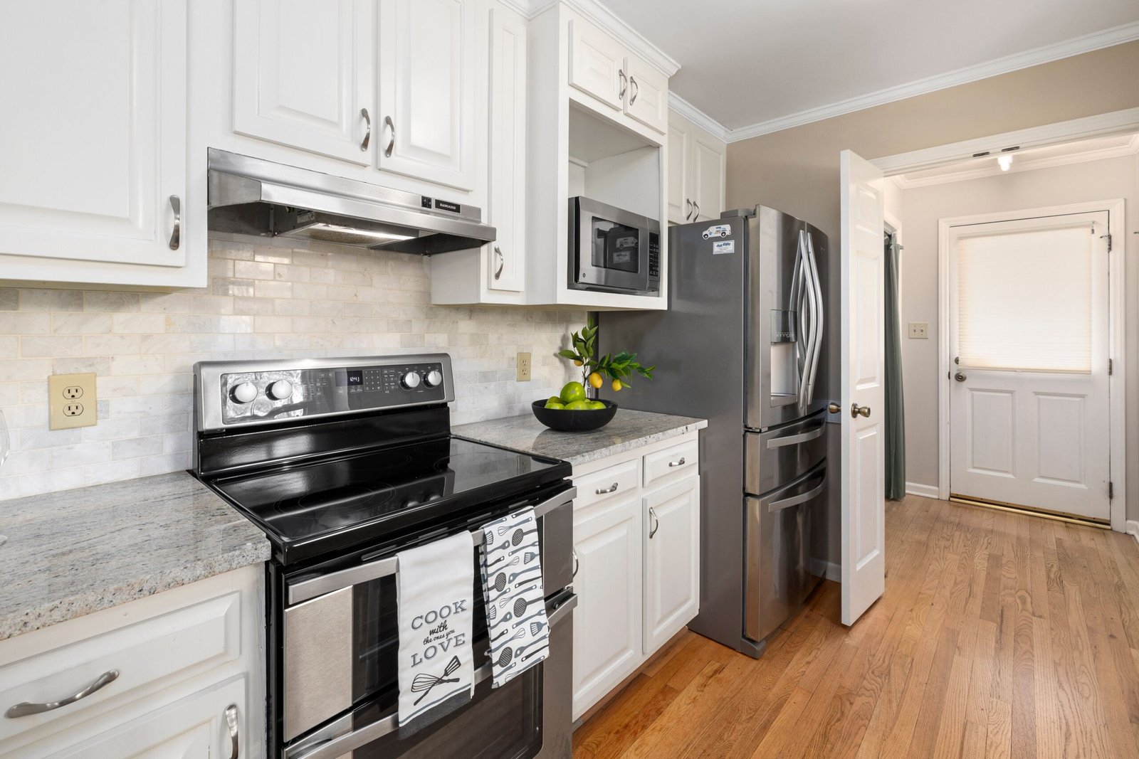 Modern kitchen with stainless steel oven and cooktop appliances