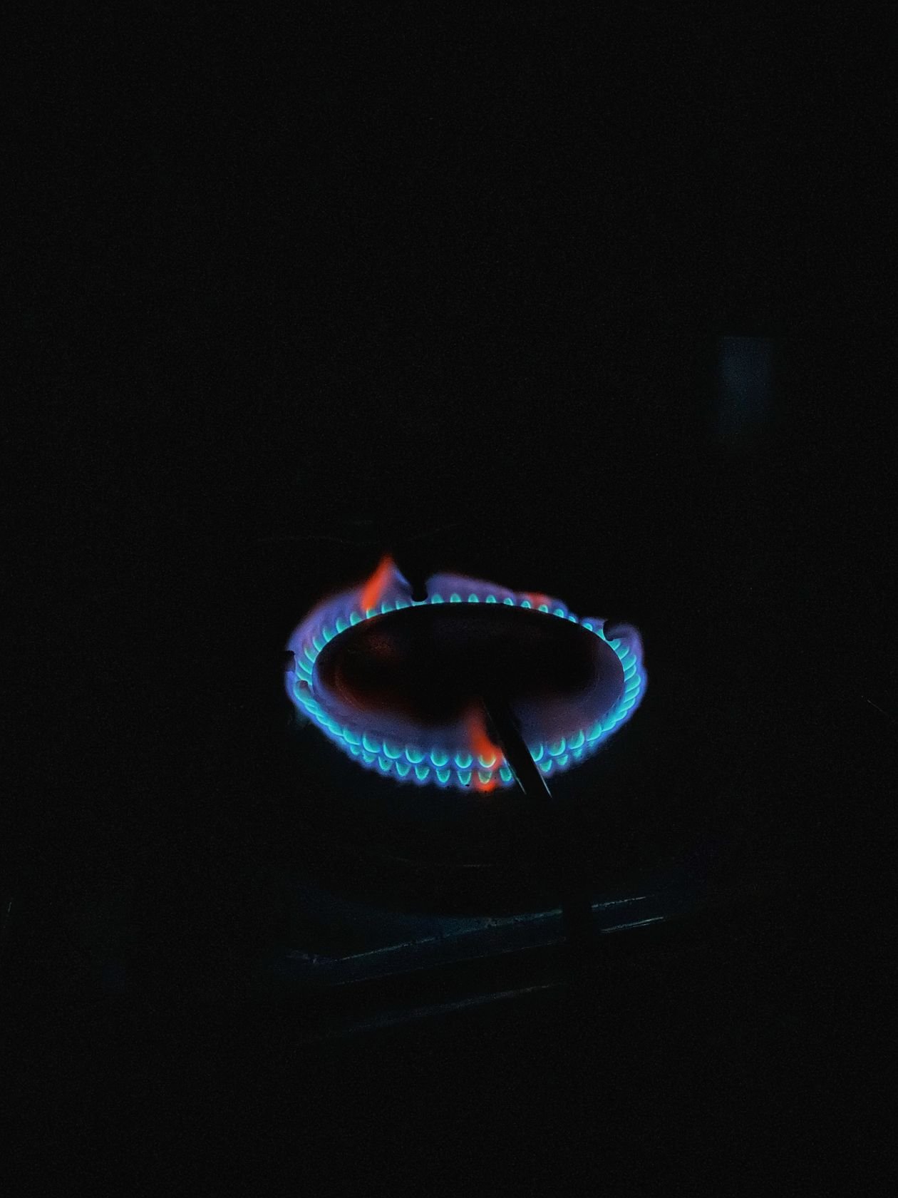 Blue flame on a gas cooktop burner