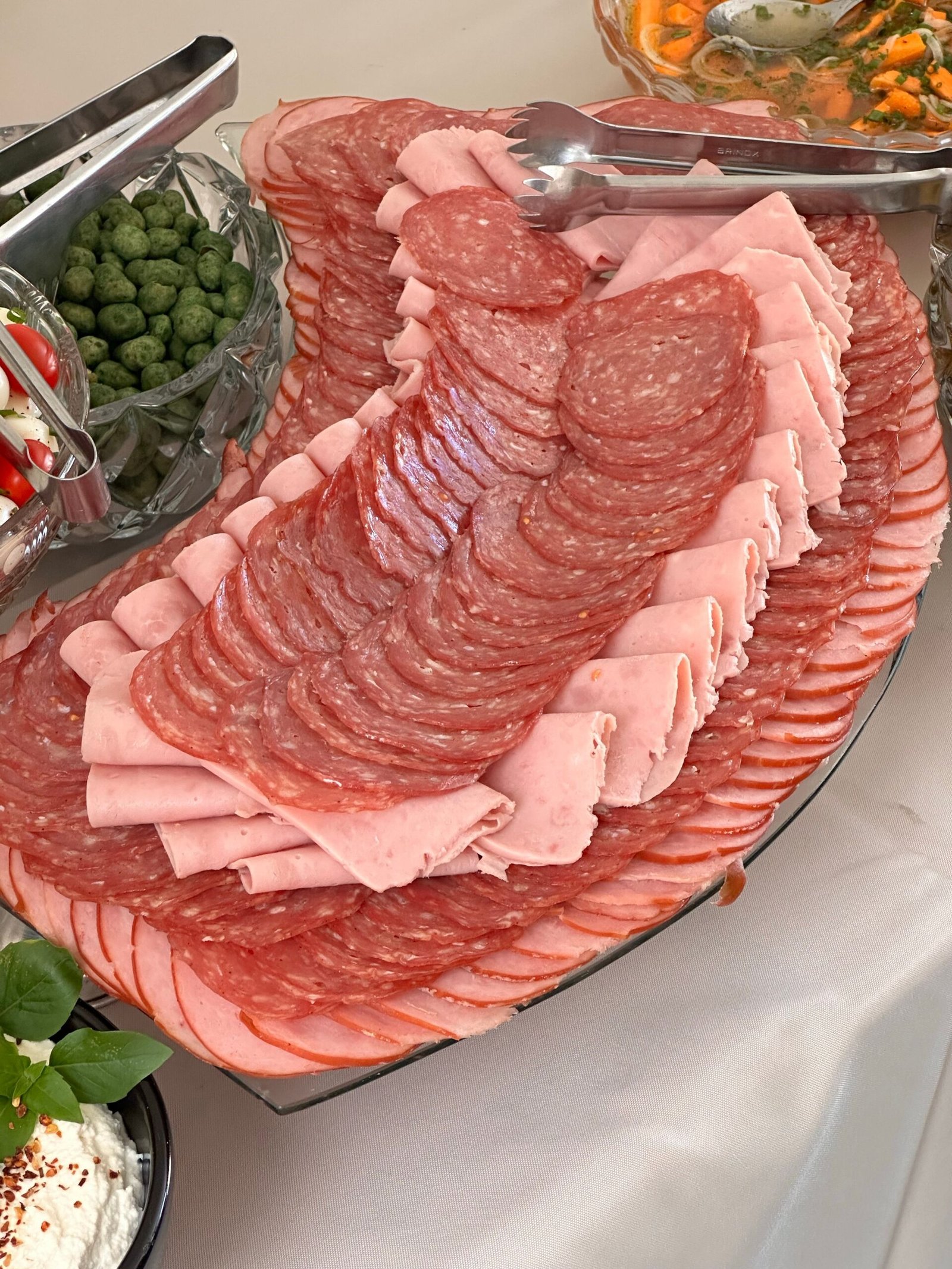 assorted sliced cold cuts displayed on a platter