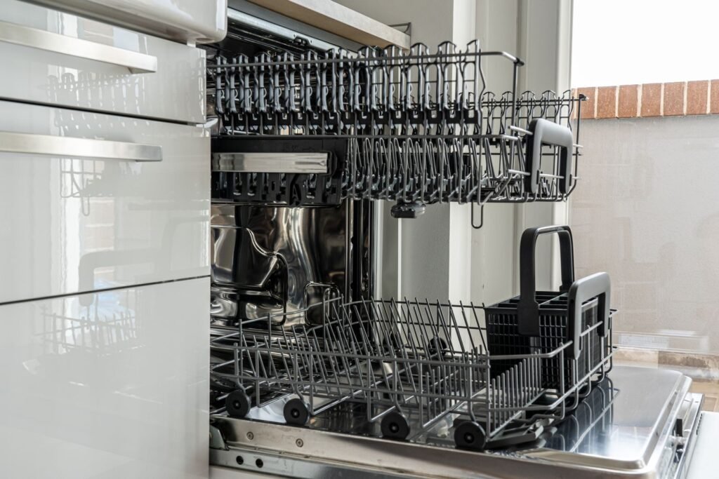 clean empty dishwasher interior with racks visible