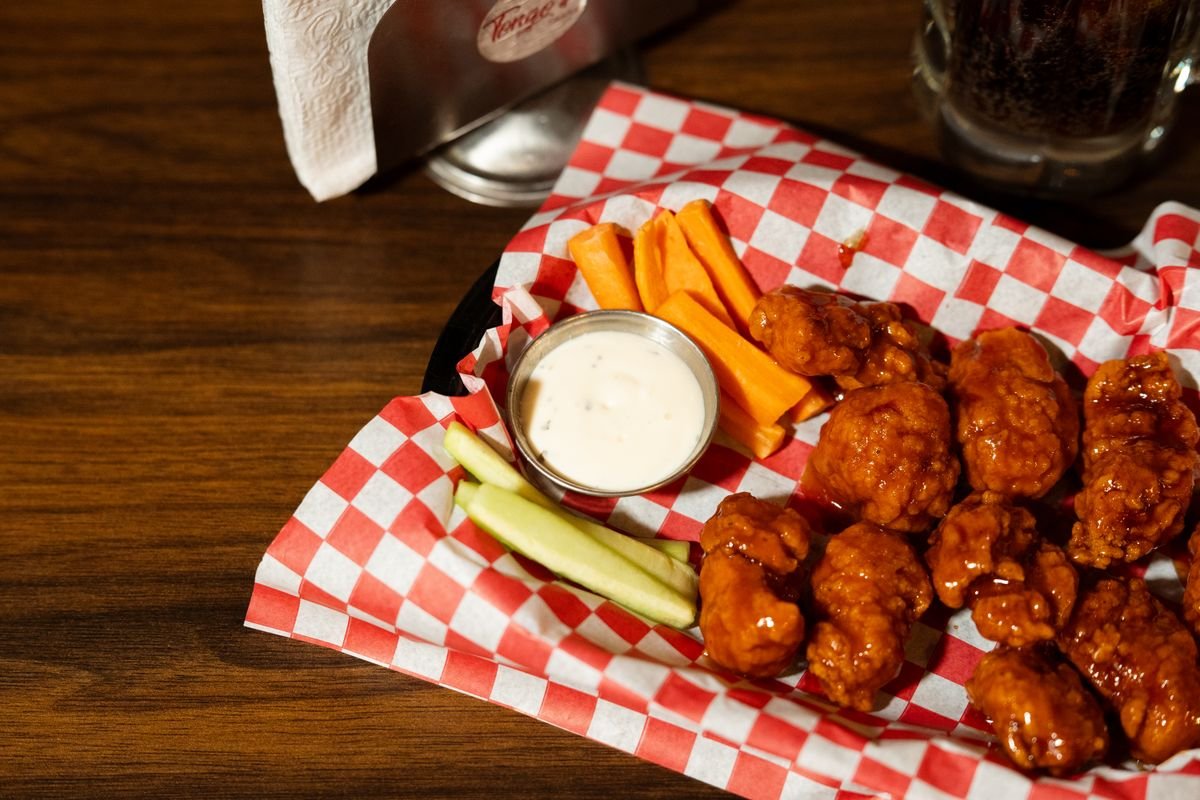 Spicy buffalo wings served with ranch dip, carrots, and celery