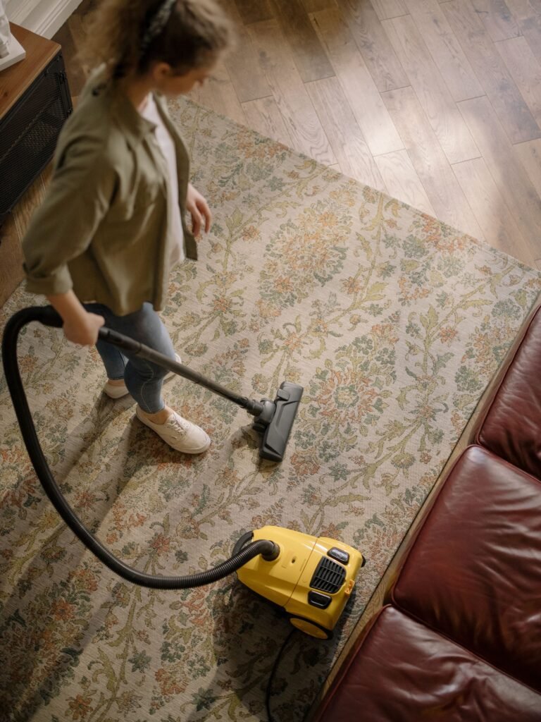 overhead view of vacuuming a patterned carpet