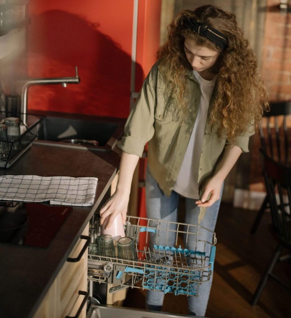 loading dishes into a dishwasher rack