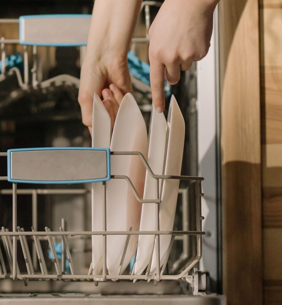 loading plates into a portable dishwasher rack