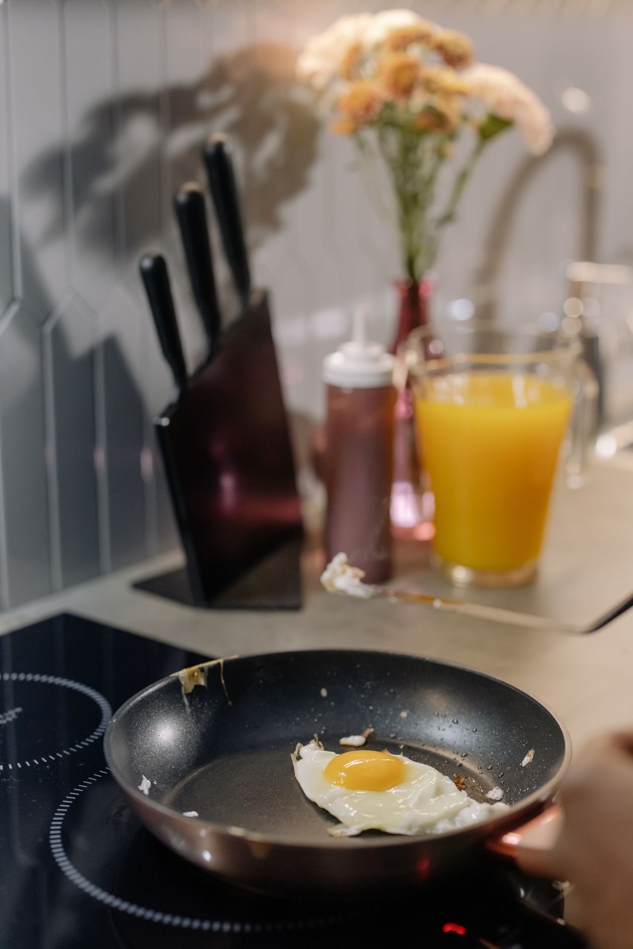 Egg cooking in a pan on an induction cooktop