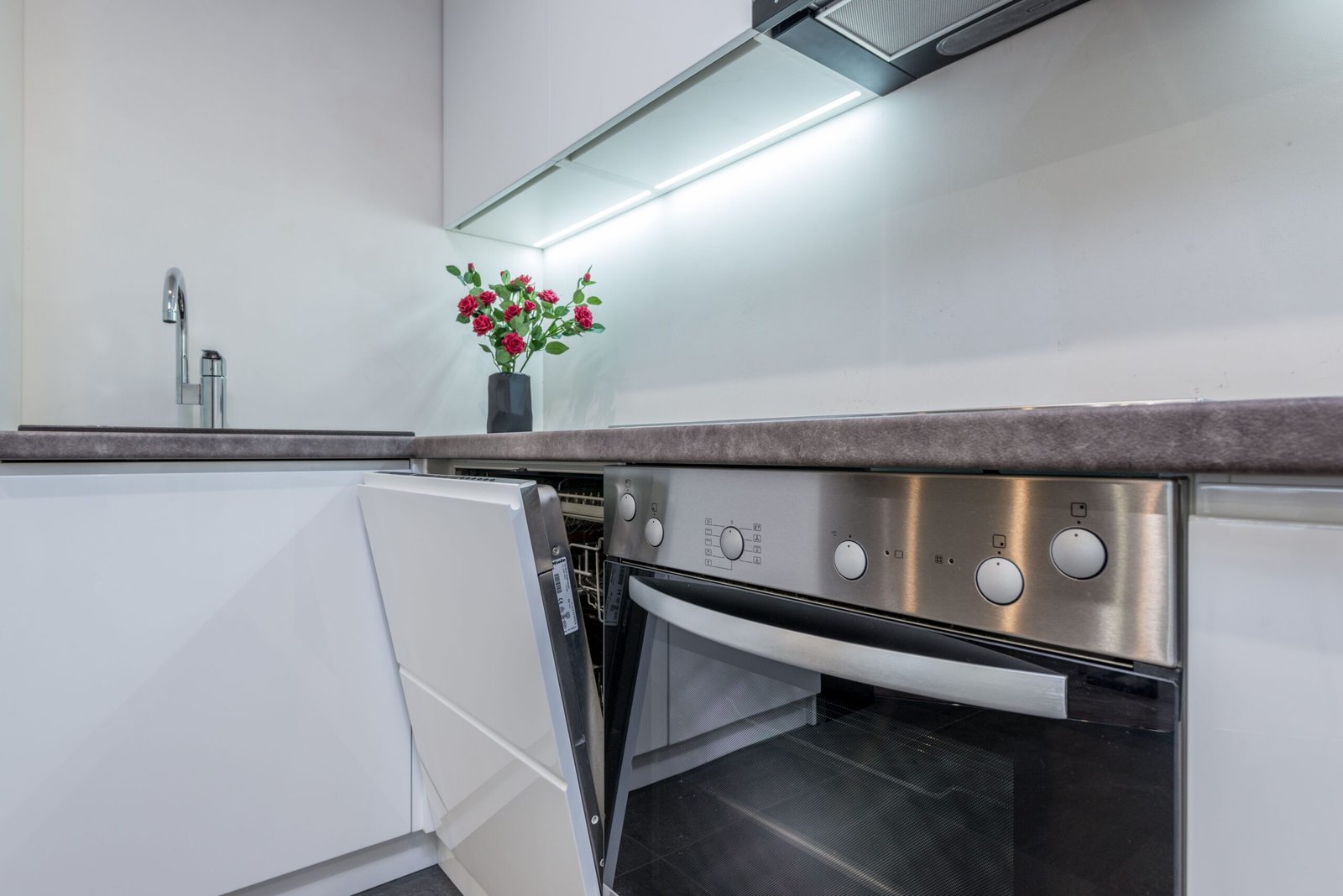 built-in dishwasher installed under kitchen counter cabinetry